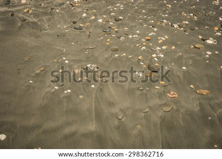 Image of sand and pebbles on the beach, Andros, Greece