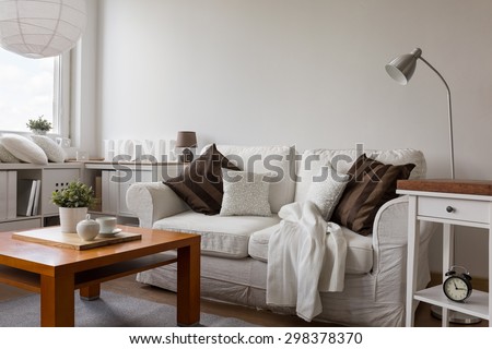 Small cozy living room in white flat Royalty-Free Stock Photo #298378370