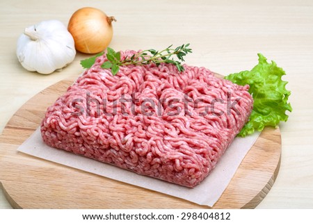 Minced meat served thyme, onion and garlic - ready for cooking