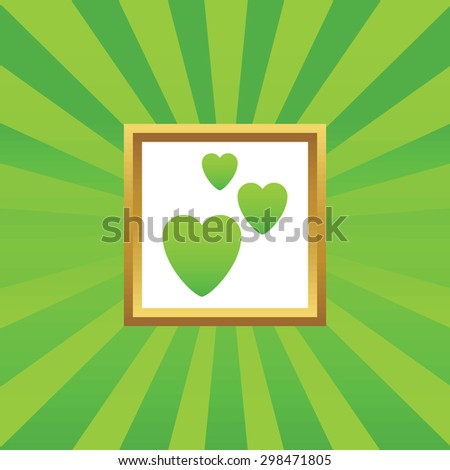 Image of three hearts in golden frame, on green abstract background