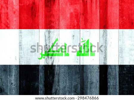 Iraq flag on wooden background