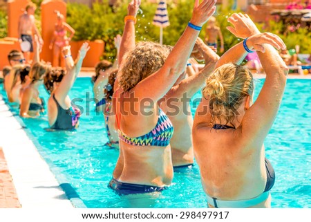 people doing acquagym in a resort pool
