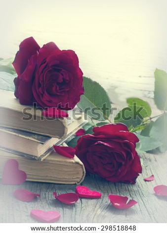 old books with red roses, vintage memories