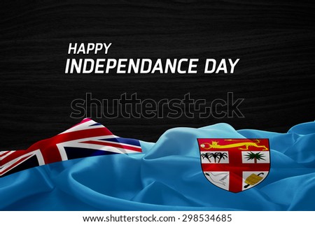 Happy Independence Day Fiji flag and wood background