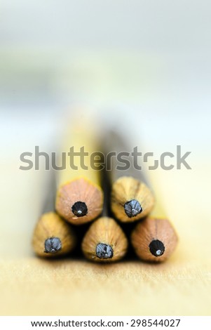 Pencils on wooden table