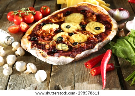 Tasty pizza with vegetables on table close up