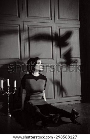Young woman in horror movie at black and white