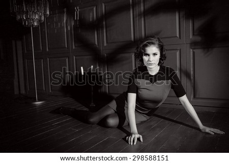 Young woman in horror movie at black and white