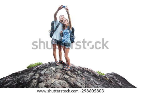 Hikers with backpack standing on the rock and taking selfie isolated on white background