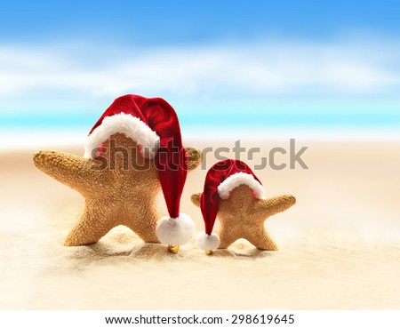 Summer beach. Merry Christmas. Starfish in Santa Claus hat. Royalty-Free Stock Photo #298619645