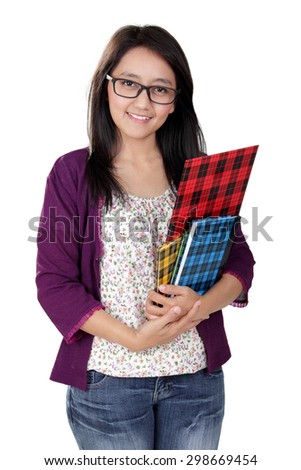 Friendly Asian teacher holding some books and smile to camera, isolated on white background