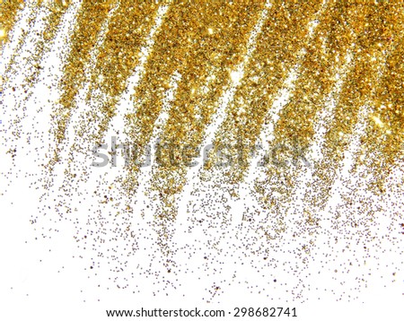 Golden glitter sparkle like a golden rain on white background