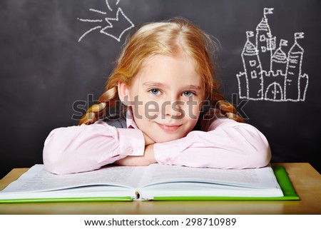 girl reading a book. School and education. imagination concept. cartoon fairy tale castle and the crown princess doodle