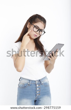 asian woman thinking holding tablet computer isolated on white background