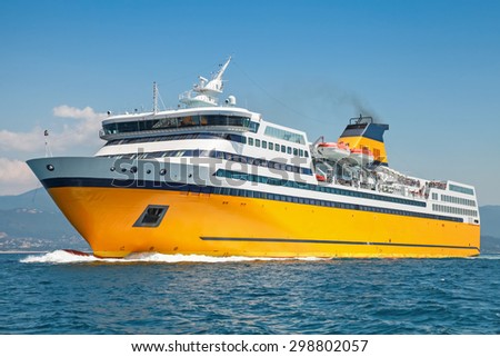 Big yellow passenger ferry goes on the Mediterranean Sea Royalty-Free Stock Photo #298802057