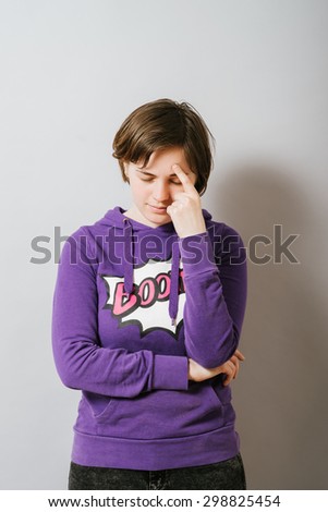 Isolated portrait of a brunette trying to remember something