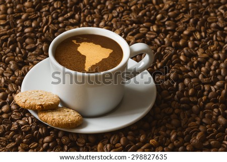 Still life photography of hot coffee beverage with map of South America continent