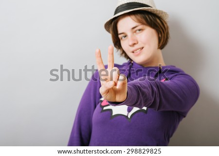 Girl shows two fingers