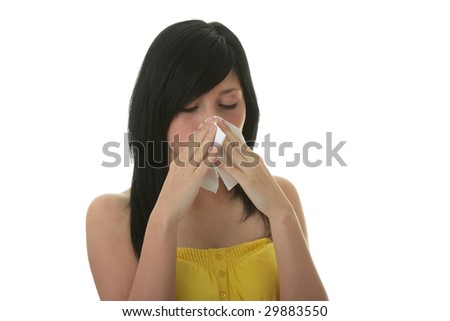 Young woman with allergy or cold holding handkerchief, isolated on white background