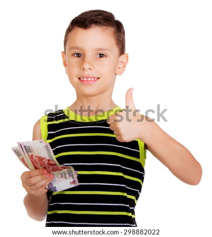 Young boy happily signing OK holding his money