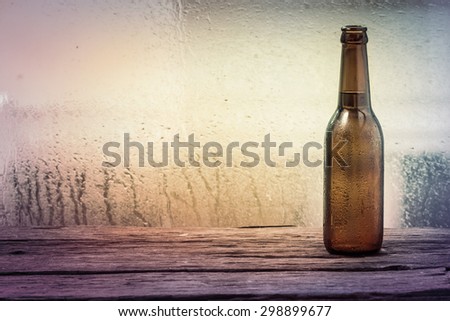 Beer bottle on  wooden background