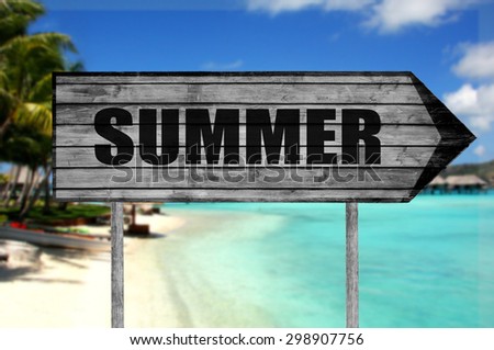 Summer wooden sign with beach background
