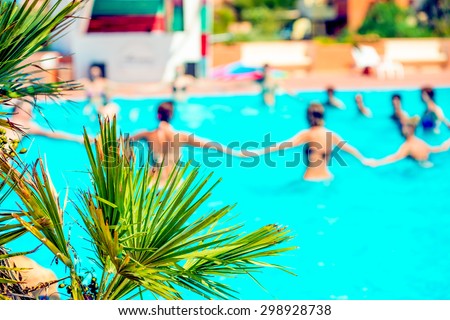 People doing acquagym in a resort
