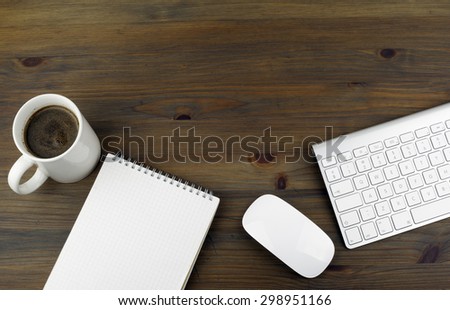 Office table with notebooks, computer and computer mouse. Free space for text or picture.