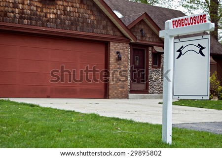 foreclosure sign in yard in the suburbs