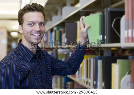 Happy young man researching information