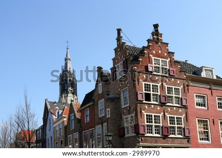 Delft historic houses with Dutch gables and church tower