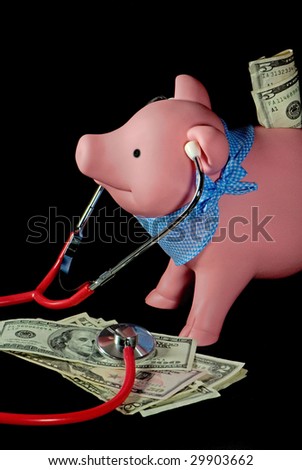 piggy bank with stethoscope on money