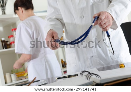 Doctor holding a stethoscope at medical office