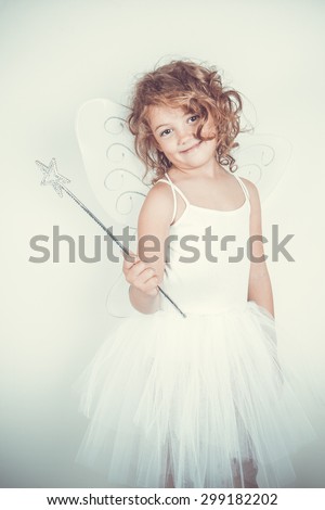 little girl with fairy costume Royalty-Free Stock Photo #299182202