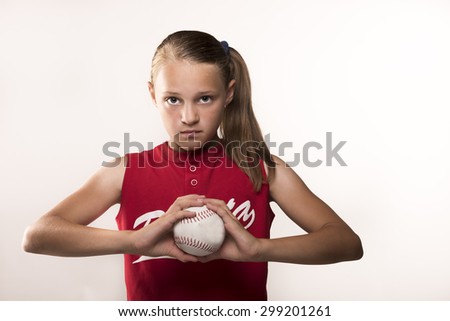 Softball girl with ball in hands