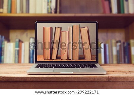 E-book library concept with laptop computer and books