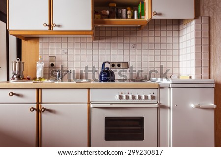interior of an old simple kitchen that should be renovated Royalty-Free Stock Photo #299230817