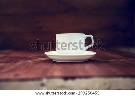 Cup of ?offee on a wooden table