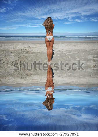 beautiful girl in the beach looking the sea