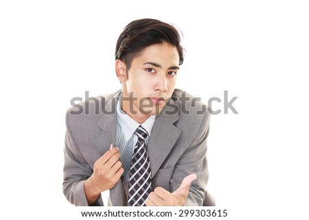 Asian business man showing thumbs up sign 