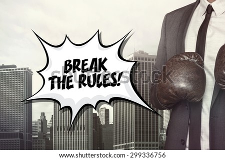 Break the rules text with businessman wearing boxing gloves on cityscape background