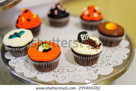 Multicolor Halloween cupcakes on plate