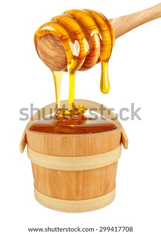 honey dripping into a bucket isolated on white