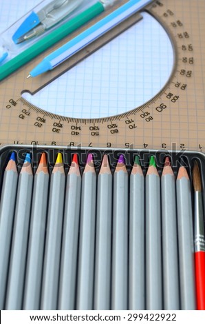 Colored pencils, pen, protractor