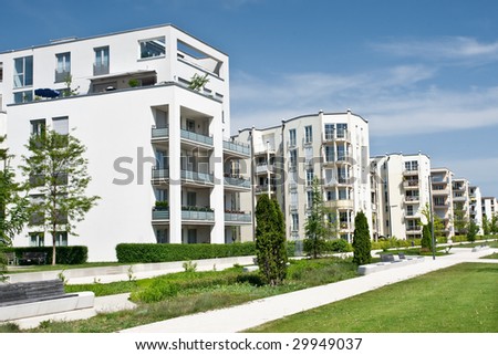 A newly completed housing estate in a summer setting. Royalty-Free Stock Photo #29949037