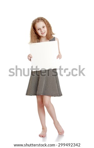 Beautiful blonde girl with haircut caret in a gray silk dress with no shoes holding before him a square sheet of cardboard on which you can write ads-Isolated on white background