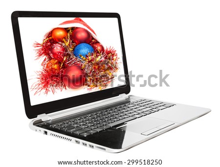 Christmas still life with red and blue balls on screen of laptop isolated on white background