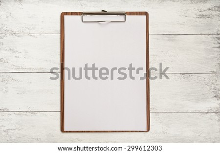 Wooden clipboard on wood background Royalty-Free Stock Photo #299612303