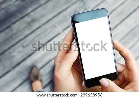 Hands holding phone Royalty-Free Stock Photo #299658956