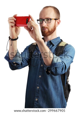 Image of man taking pictures with his smartphone isolated on white